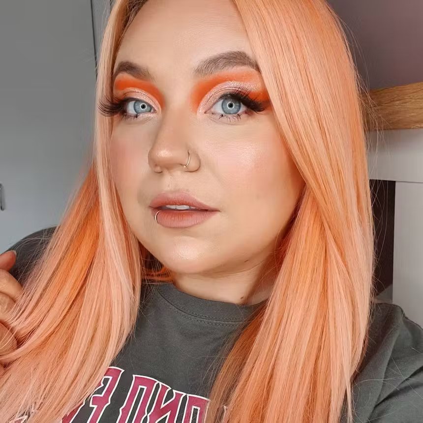 user generated image of woman with peachy coral pastel hair