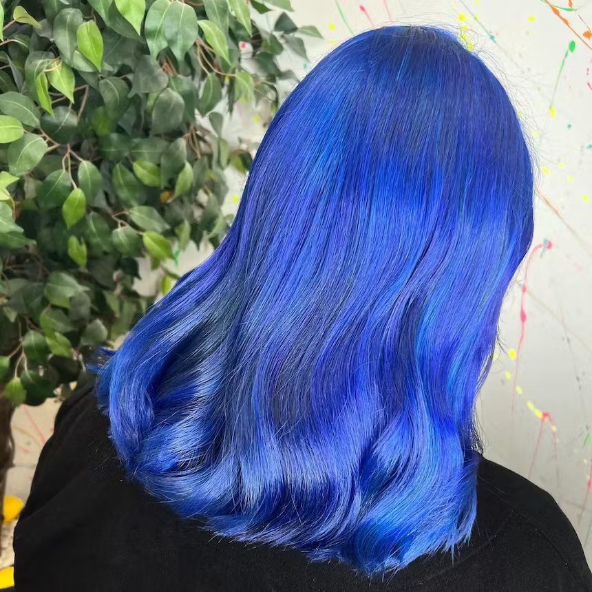 Crazy Color CASA UGC image of back of woman's bright blue hair 