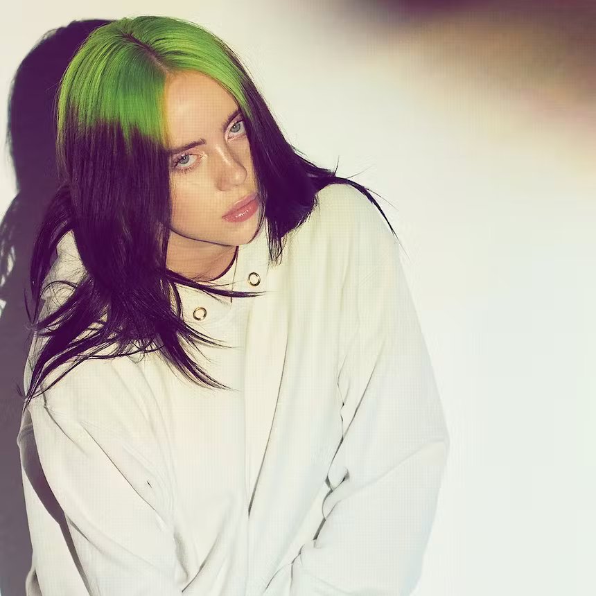 image of Billie Eilish with bright green roots and long black hair
