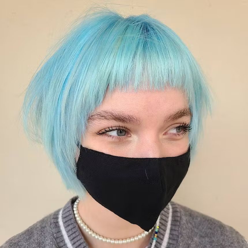 user generated image of woman with cropped pastel blue hair