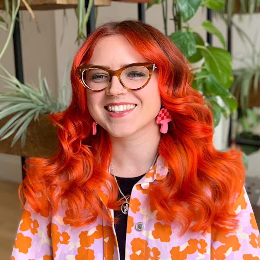 user generated image of woman with long orange red curly ombre hair