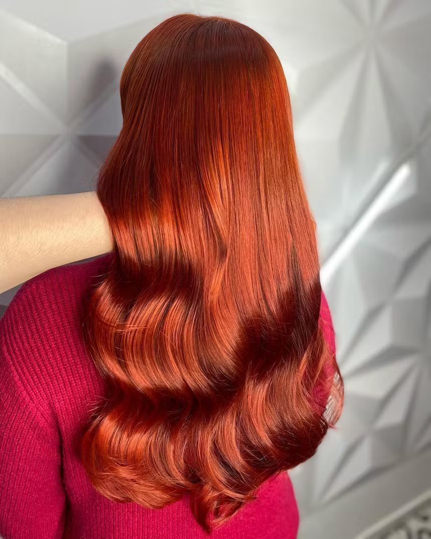 image of the back of girls head with long copper hair