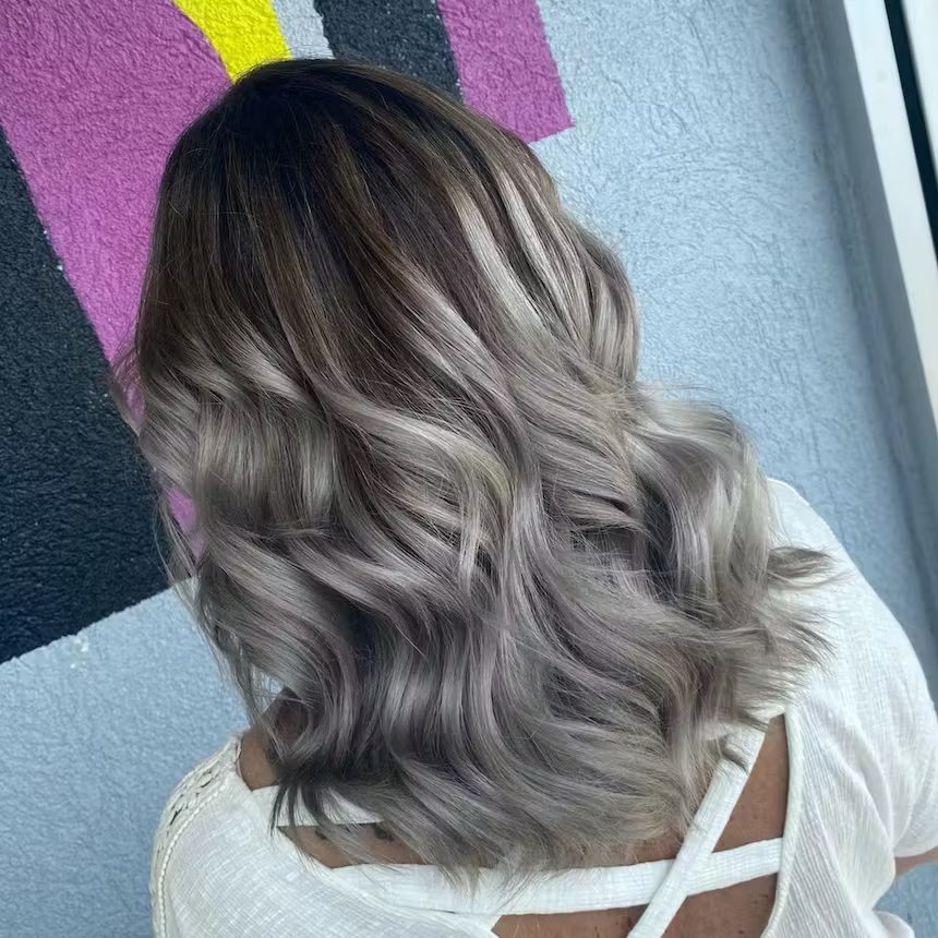 user generated image of a close up of back of woman's long ombre grey metallic hair